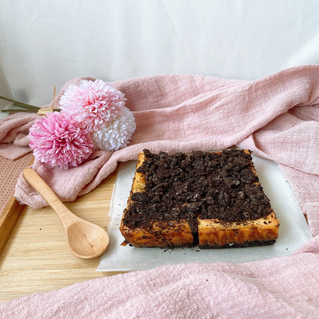 Baked Oreo Cheesecake topped with crushed Oreo bits