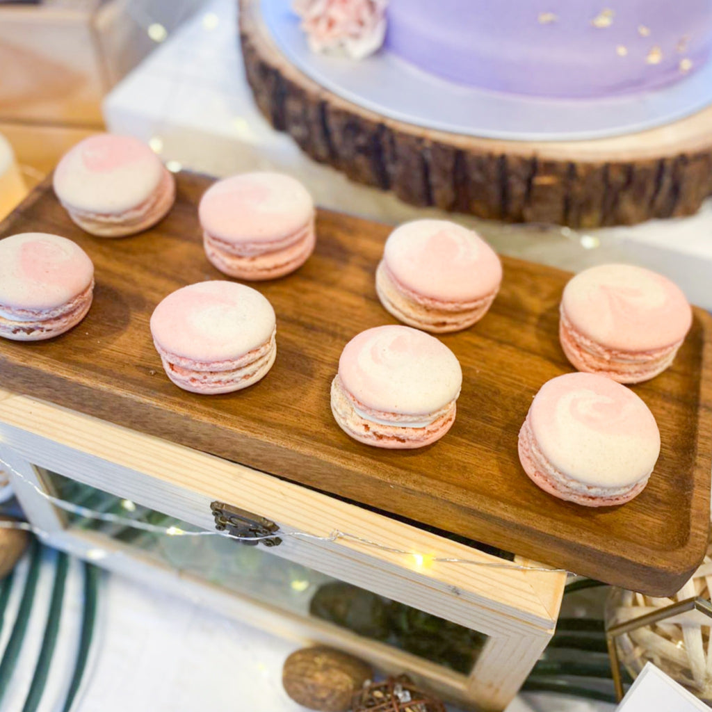 White pink swirled macarons