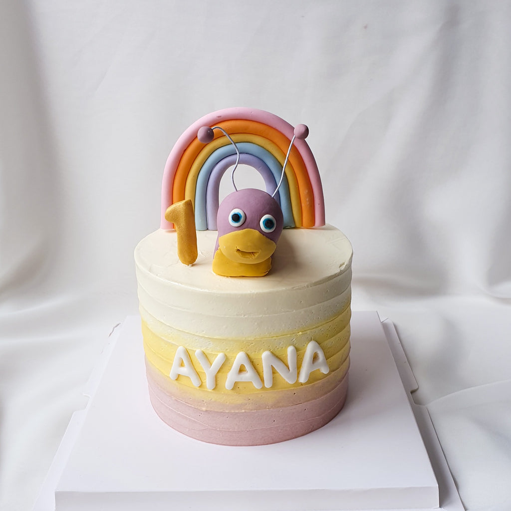 Rainbow baby tulli cake with white fondant letters